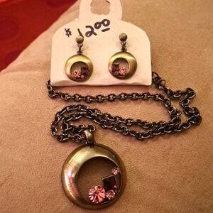 Vintage necklace & earring set. Bronze color base with purple & pink stones.